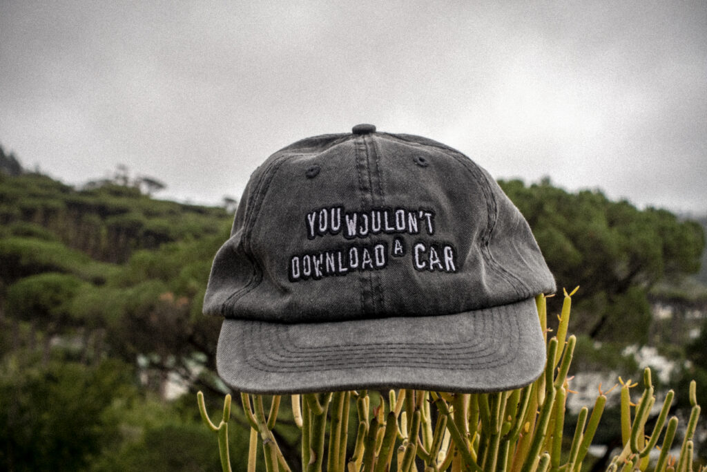 Dad cap displaying the slogan, "You wouldn't download a car". New cap, funny cap, camper cap, washed cotton, Irony, Humor, meme, Brass clasp.