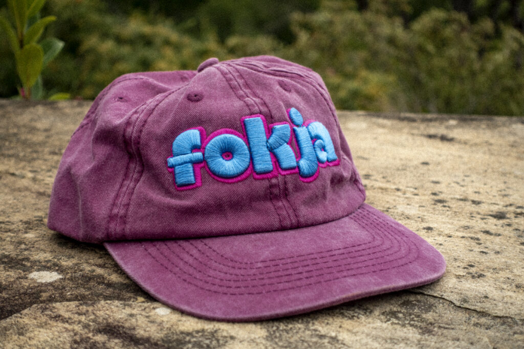 Faded maroon dad cap displaying the word "fokja" in the "okja" font. New cap, funny cap, camper cap, washed cotton, Irony, Humor, meme, Brass clasp.